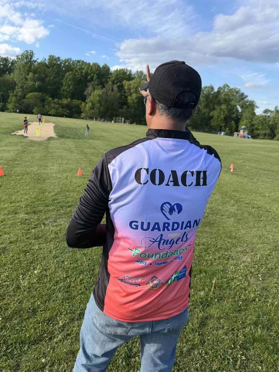 Coach overseeing practice on the pitch