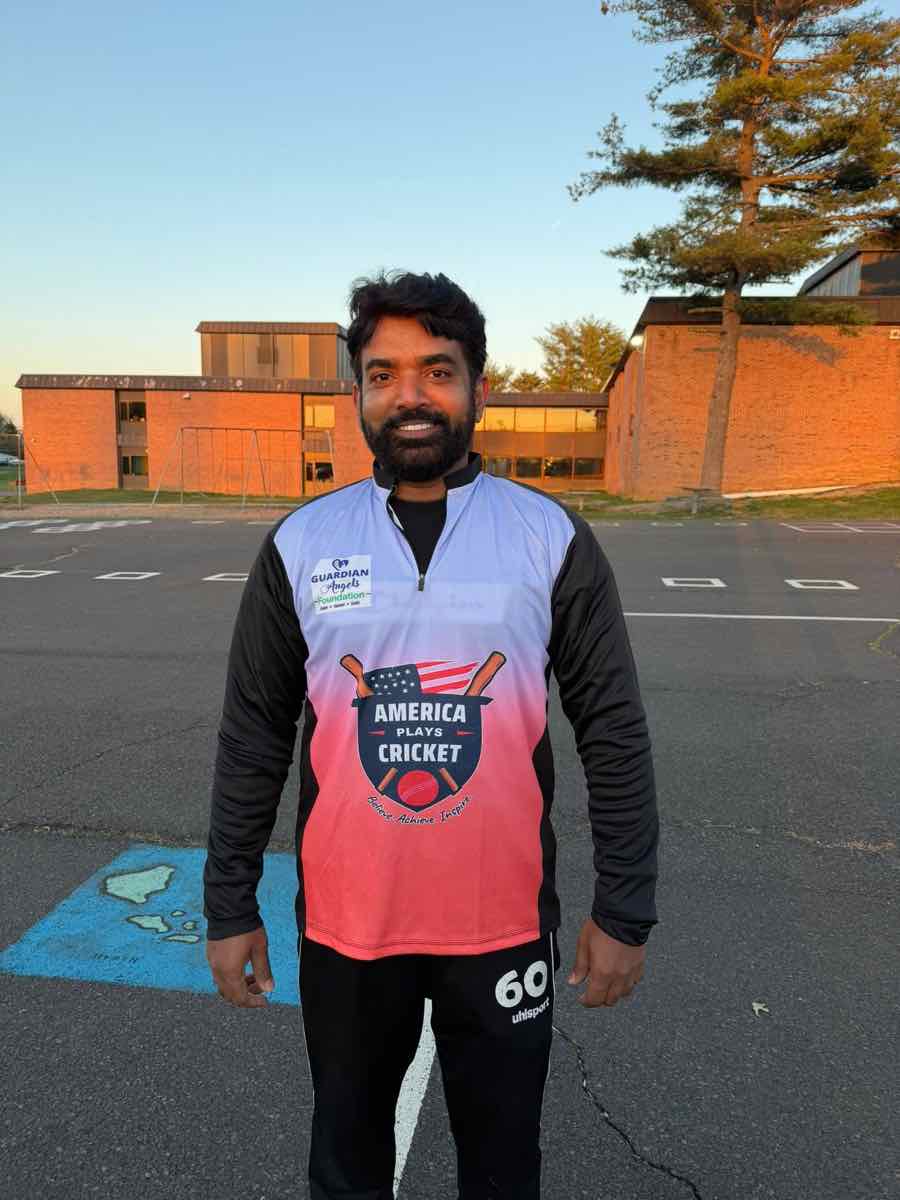 America Plays Cricket coach smiling on the field