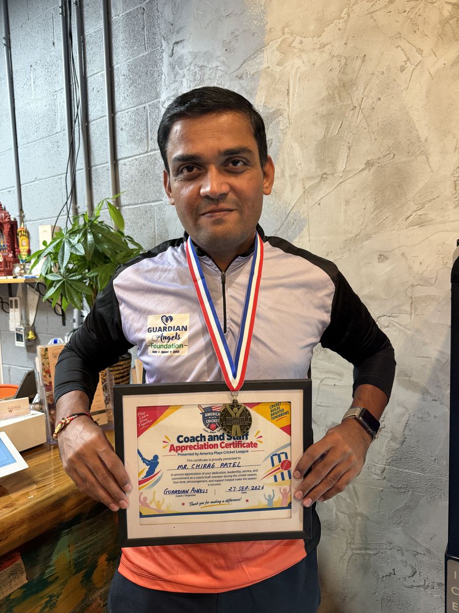 Mr. Chirag Patel holding his Coach and Staff Appreciation Certificate
