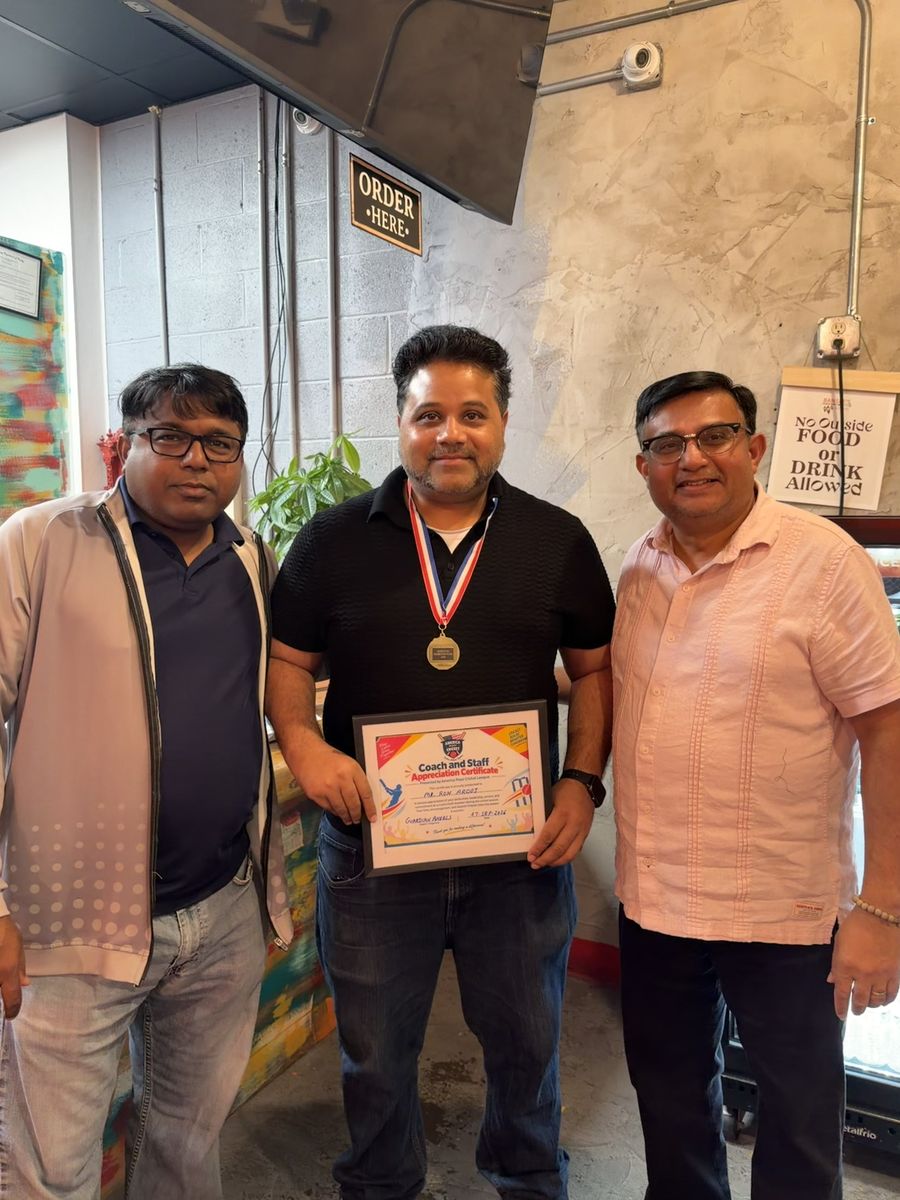 Mr. Ron Arooj celebrating with fellow coaches after receiving his certificate